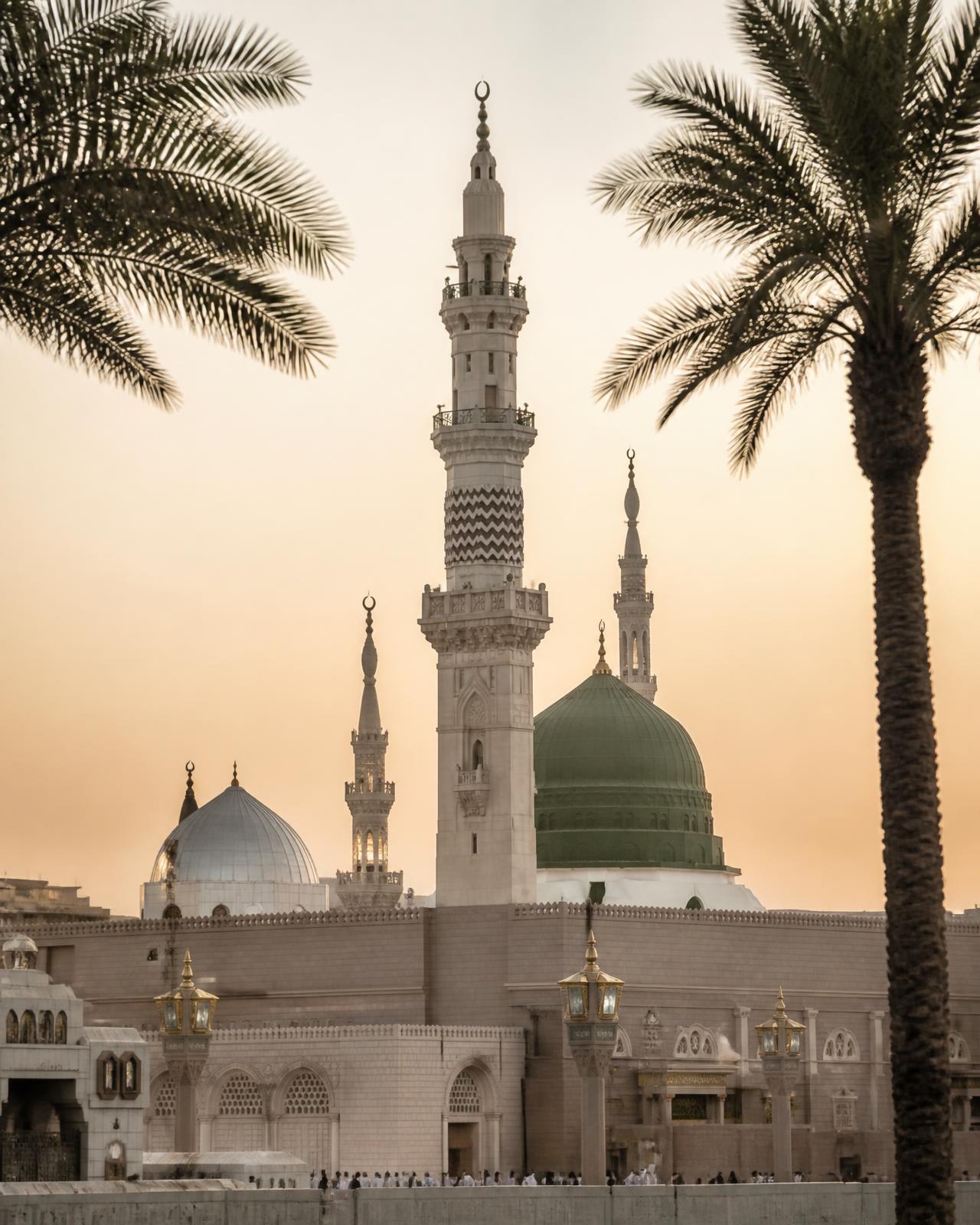 The Prophet's Mosque in Madinah under an evening sky